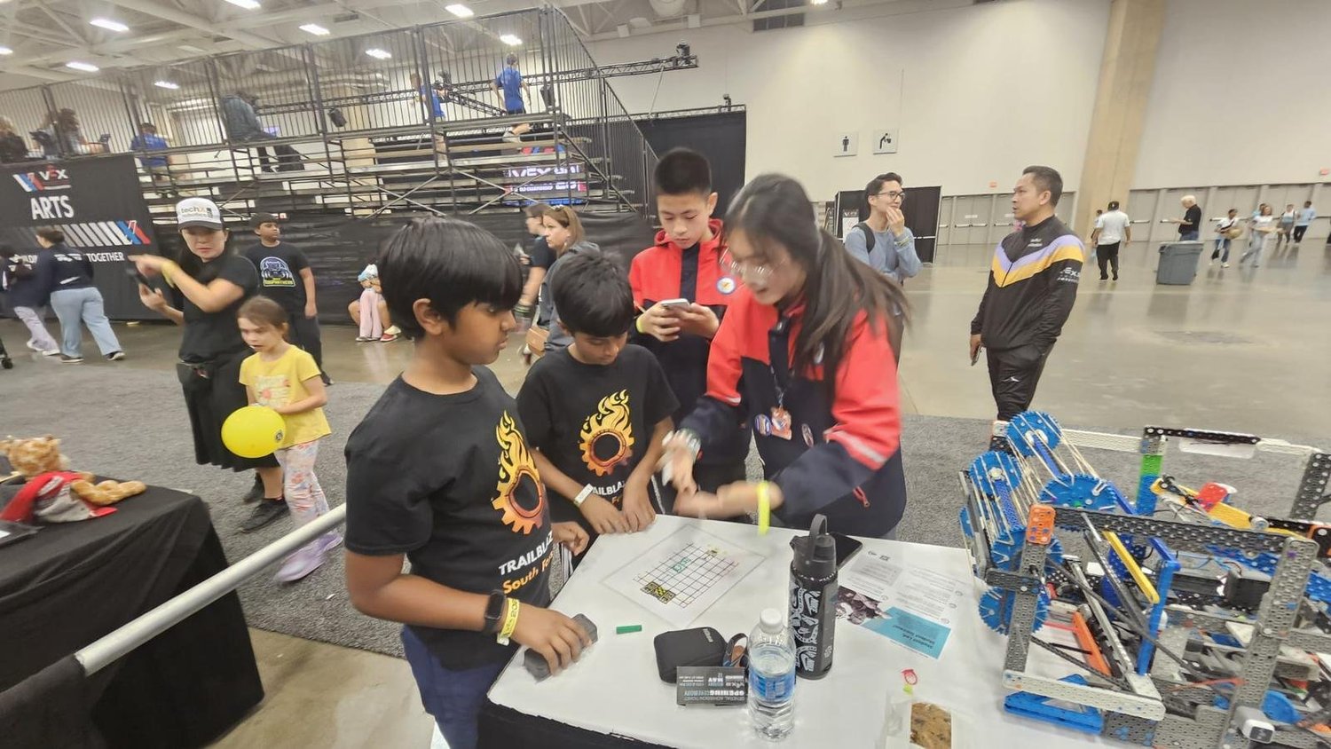 students competing with VEX IQ robot
